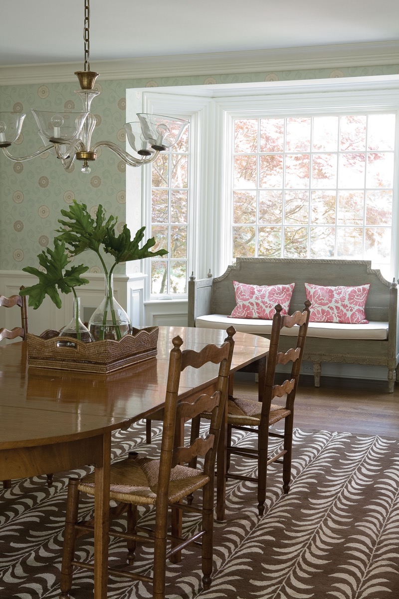 Dining room with a Swedish settee and bay window, Fairfield CT interior by Susanne Morgan