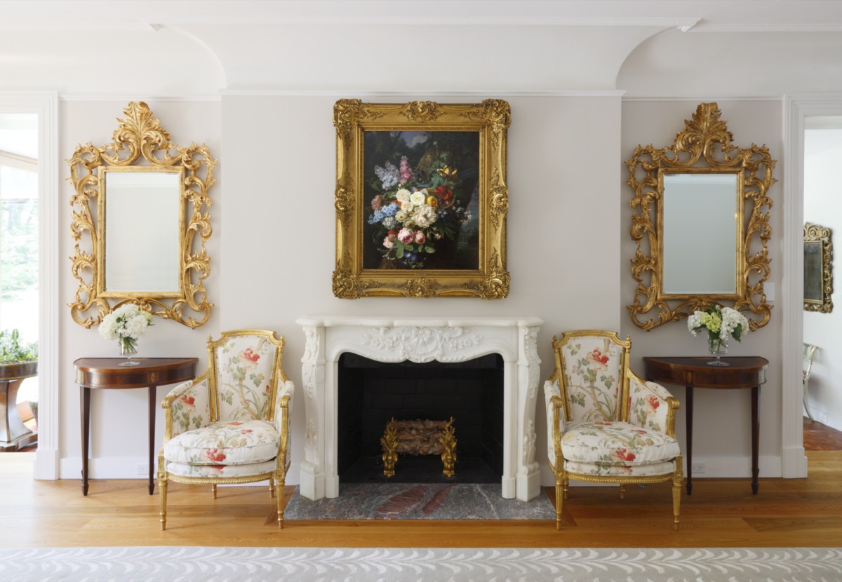 Symmetrical entry hall with gilt mirrors and a carved fireplace, Princeton NJ