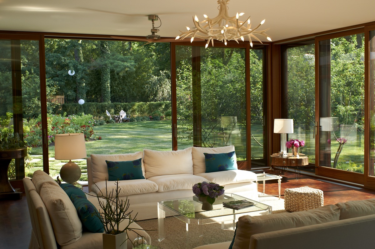 Sunroom with floor-to-ceiling windows overlooking a garden, a Princeton, NJ interior by Susanne Morgan